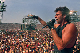 American singer-actor Rick Springfield performs before large crowd at Live Aid famine relief concert at JFK Stadium in Philadelphia Pa., July 13, 1985.(AP Photo/Amy Sancetta)