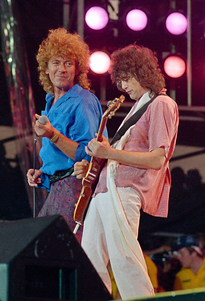 ** FILE ** Led Zeppelin bandmates, singer Robert Plant, left, and guitarist Jimmy Page, reunite to perform for the Live Aid famine relief concert at JFK Stadium in Philadelphia Pa., in this July 13, 1985, file photo. (AP Photo/Amy Sancetta, file)