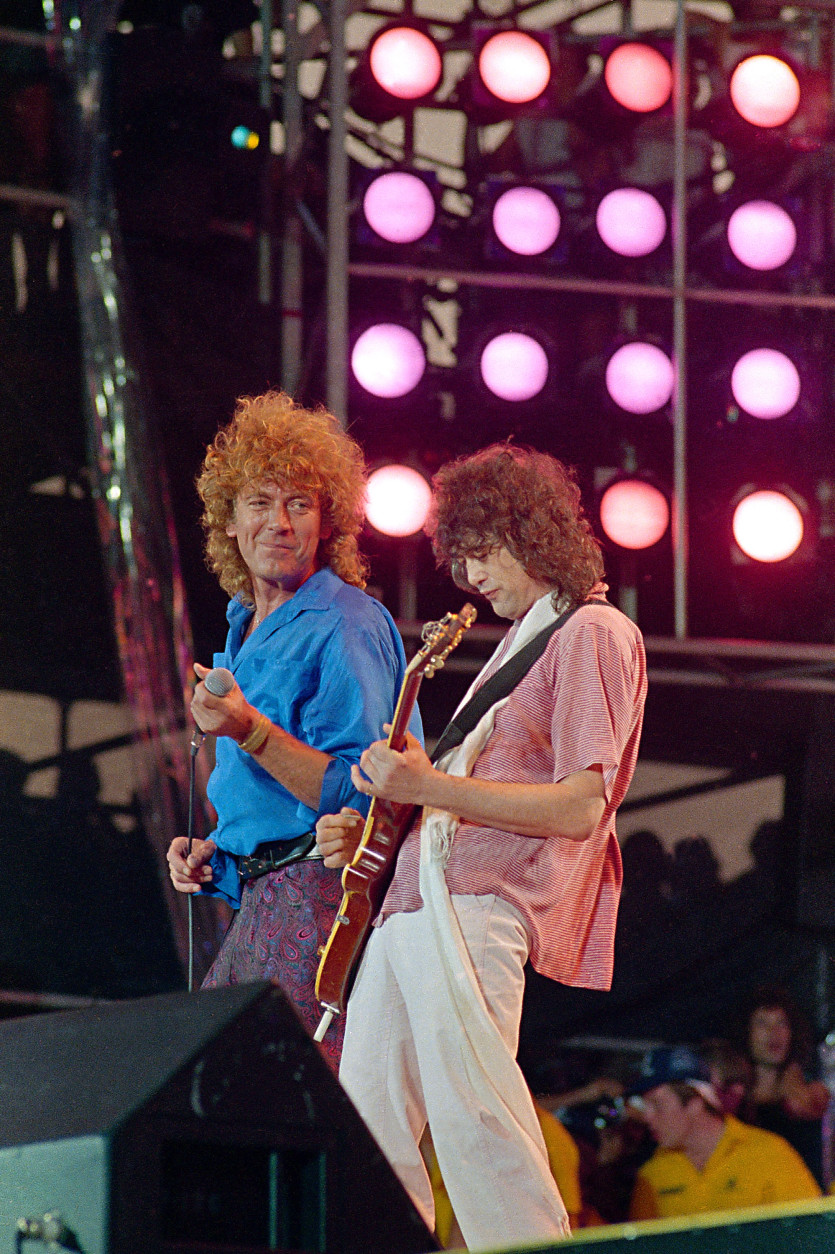 Former Led Zeppelin bandmates, singer Robert Plant, left, and guitarist Jimmy Page, reunite to perform for the Live Aid famine relief concert at JFK Stadium in Philadelphia Pa., July 13, 1985. (AP Photo/Amy Sancetta)