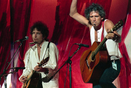 American singer-songwriter Bob Dylan, left, is joined onstage by Rolling Stones guitarist Keith Richards during Live Aid famine relief concert at JFK Stadium in Philadelphia on July 13,1985. (AP Photo/Amy Sancetta)