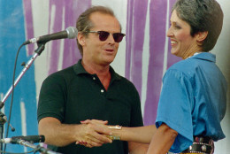 Actor Jack Nicholson, left, greets singer Joan Baez onstage, during the Live Aid concert for famine relief at JFK Stadium in Philadelphia, Pa. July 13, 1985.(AP Photo)