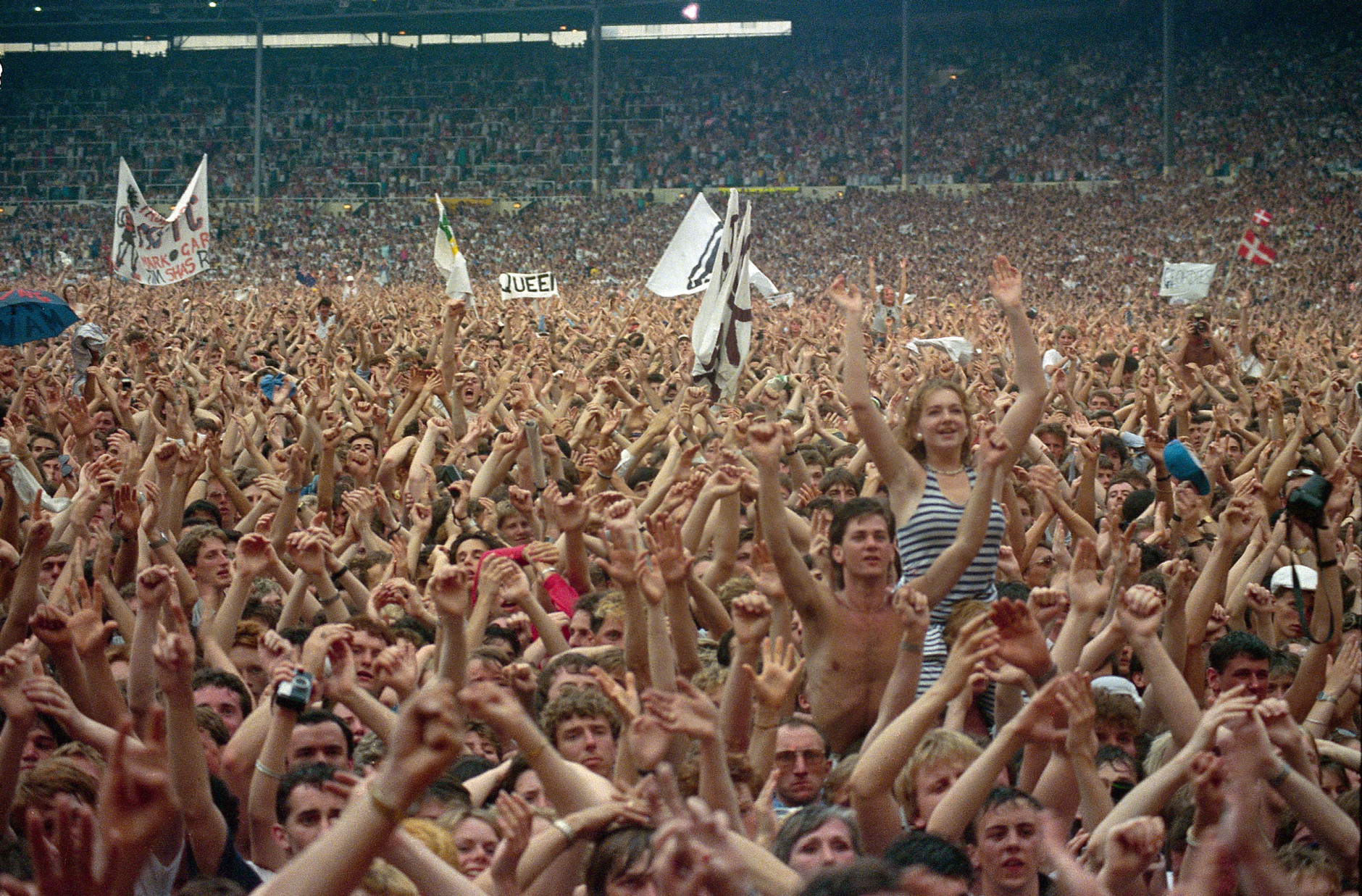 Crowd cheers during Live Aid famine relief concert at Wembley Stadium in London, England July 13, 1985 (AP Photo)