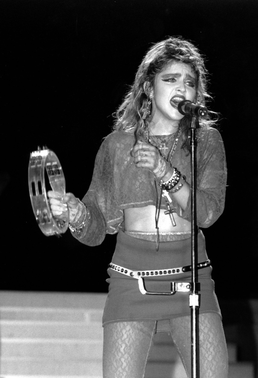 Madonna sings during a Live Aid concert in Philadelphia's JFK Stadium on July 13, 1985.  (AP Photo/Rusty Kennedy)