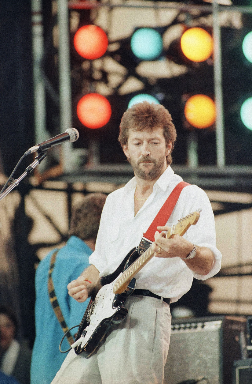 Eric Clapton performs at the Live Aid concert in Philadelphia, July 13, 1985. (AP Photo/George Widman)