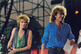 Robert Plant, right, Paul Martinez, left during Live Aid concert on July 13, 1985. Location unknown. (AP Photo/Amy Sancetta)