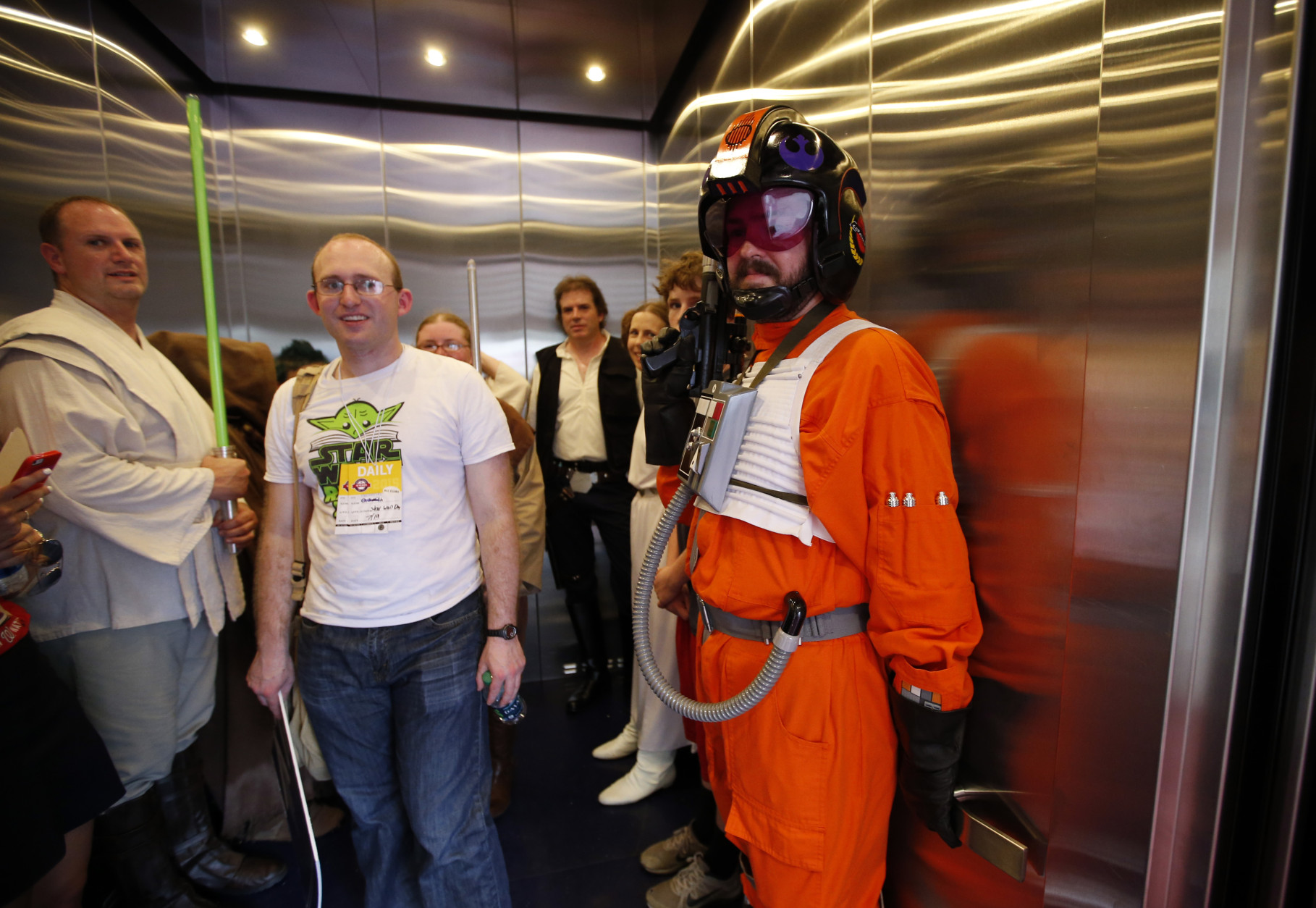 People dressed as Star Wars characters crowd in an elevator to take a break on Star Wars day before a baseball game between the Washington Nationals and the Los Angeles Dodgers at Nationals Park, Sunday, July 19, 2015, in Washington. (AP Photo/Alex Brandon)