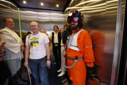 People dressed as Star Wars characters crowd in an elevator to take a break on Star Wars day before a baseball game between the Washington Nationals and the Los Angeles Dodgers at Nationals Park, Sunday, July 19, 2015, in Washington. (AP Photo/Alex Brandon)