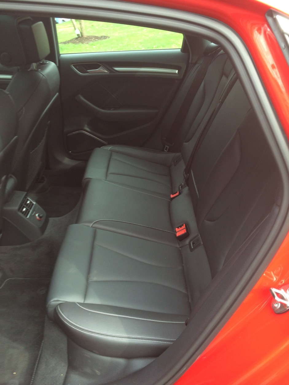 The back seats don't have much legroom, but the leather comfortably holds you in place. (WTOP/Mike Parris)