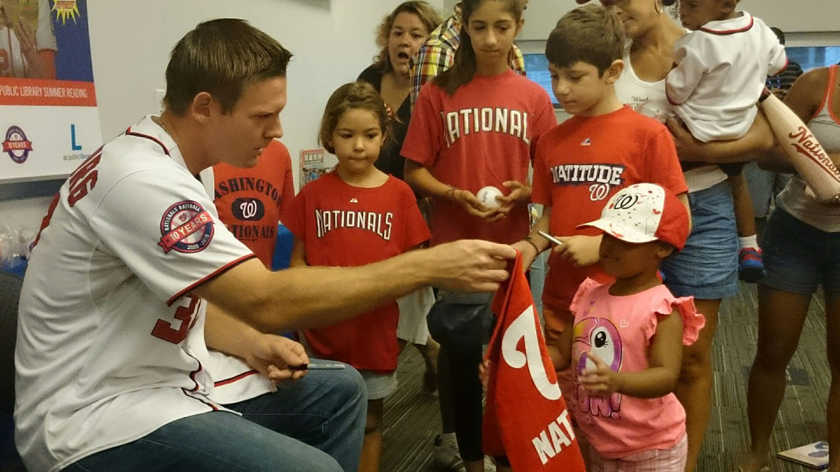 Washington Nationals starting pitcher Stephen Strasburg  meets with young fans at Anacostia Library in Washington, D.C., on Saturday,  July 18, 2015. ( Dennis J. Foley/WTOP)