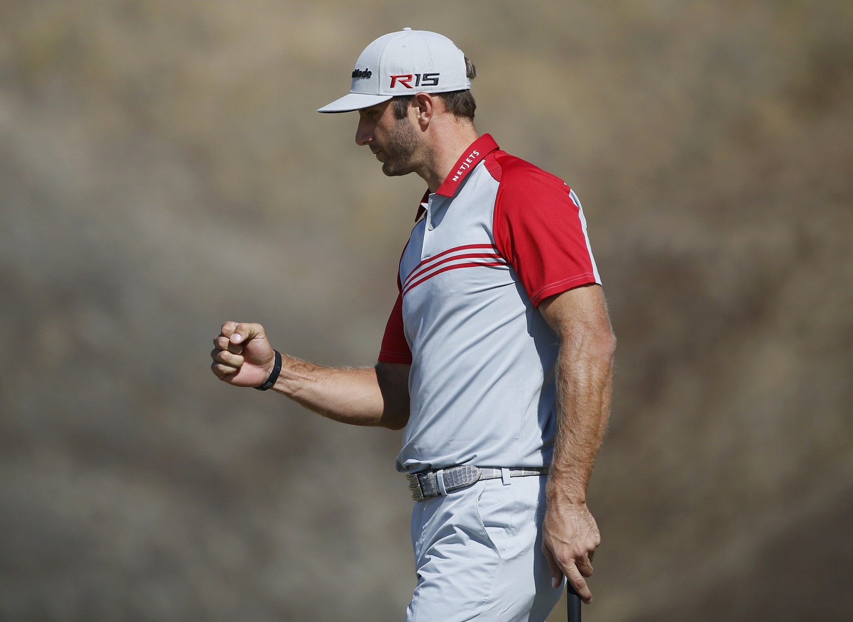 Dustin Johnson reacts after making a birdie on the ninth hole during the third round of the U.S. Open golf tournament at Chambers Bay on Saturday, June 20, 2015 in University Place, Wash. (AP Photo/Lenny Ignelzi)