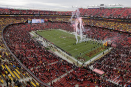 Fireworks inside of FedEx Field mark the team entrances before an NFL football game between the Washington Redskins and the Tampa Bay Buccaneers in Landover, Md., Sunday, Nov. 16, 2014. (AP Photo/Mark Tenally)