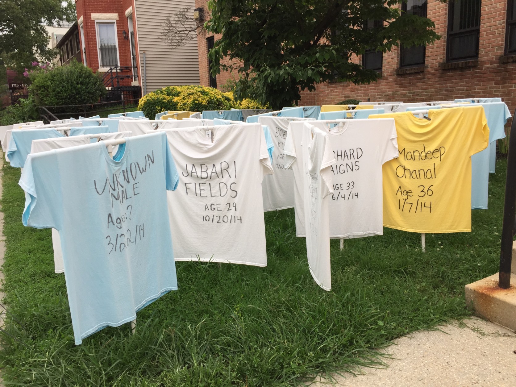 THie shirts are white for victims from the District; blue for Maryland, and yellow for northern Virginia. (WTOP/Andrew Mollenbeck)