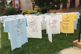 THie shirts are white for victims from the District; blue for Maryland, and yellow for northern Virginia. (WTOP/Andrew Mollenbeck)