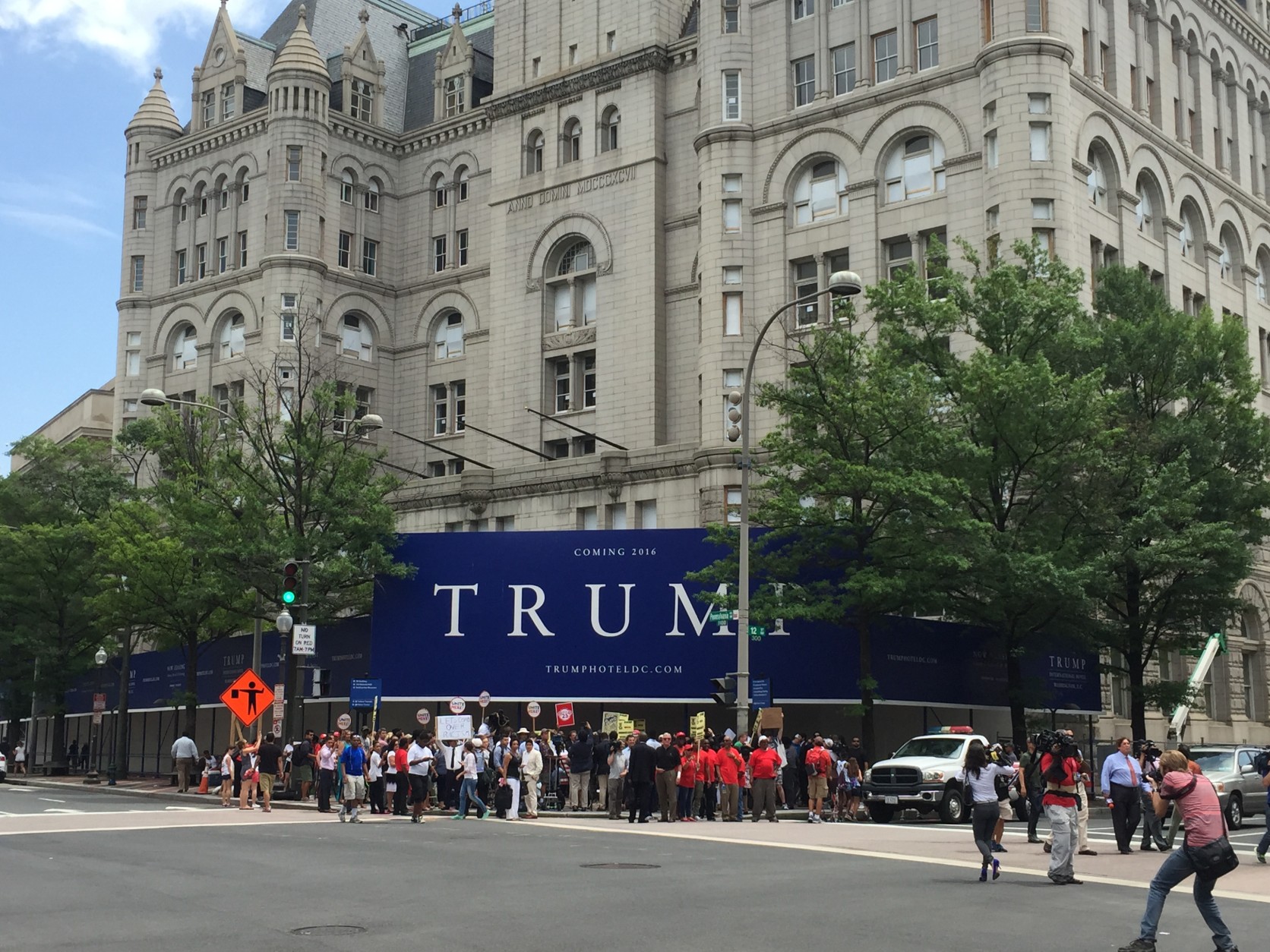 D.C. Council member Charles Allen says the construction sign outside Donald Trump's future hotel looks very similar to materials used in his presidential campaign.  (WTOP/Andrew Mollenbeck)