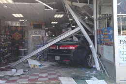 No one was hurt when this car crashed into a liquor store in Lanham on Wednesday. (Prince George's County Police Department)