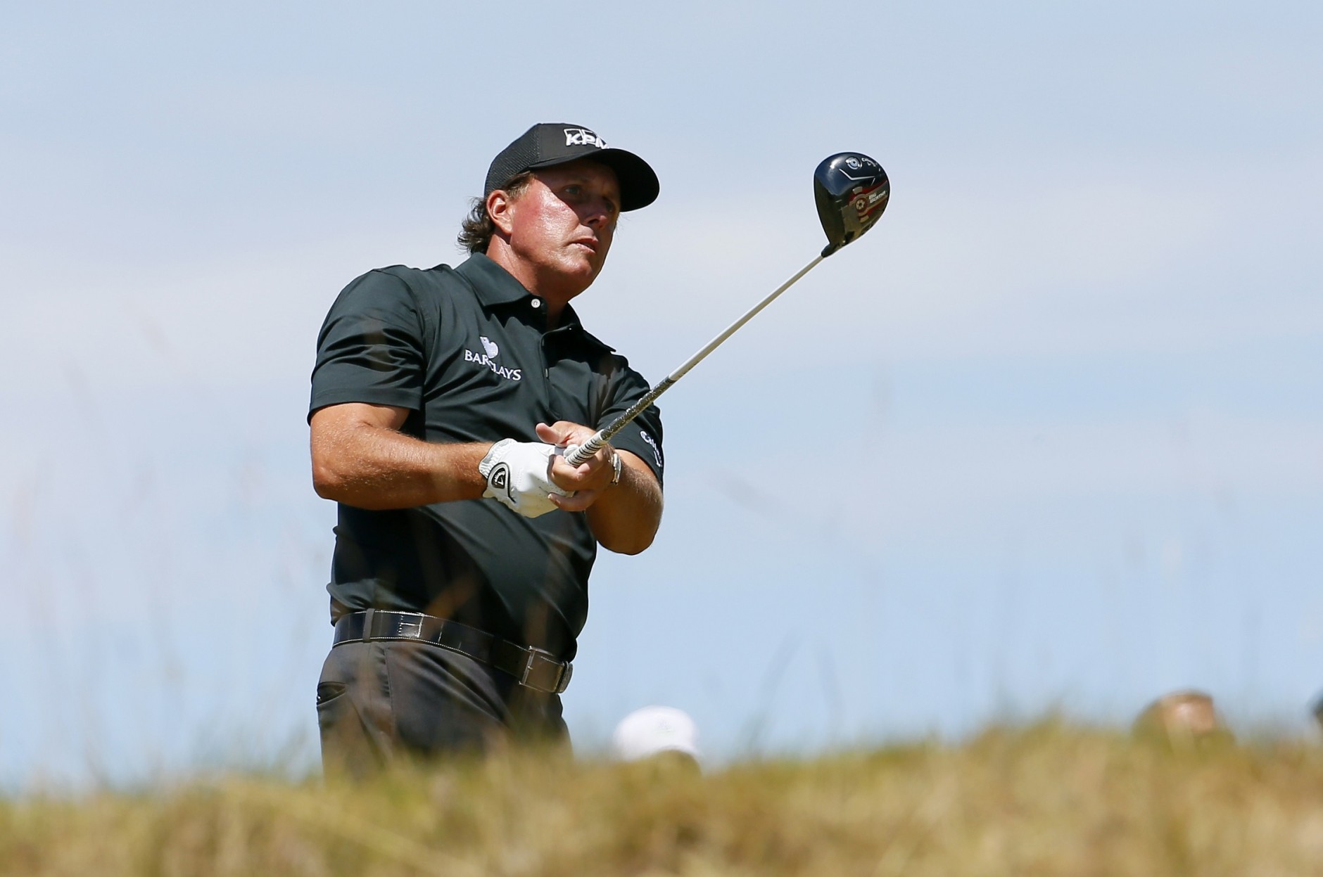 Phil Mickelson watches his tee shot on the 18th hole during the final round of the U.S. Open golf tournament at Chambers Bay on Sunday, June 21, 2015 in University Place, Wash. (AP Photo/Matt York)