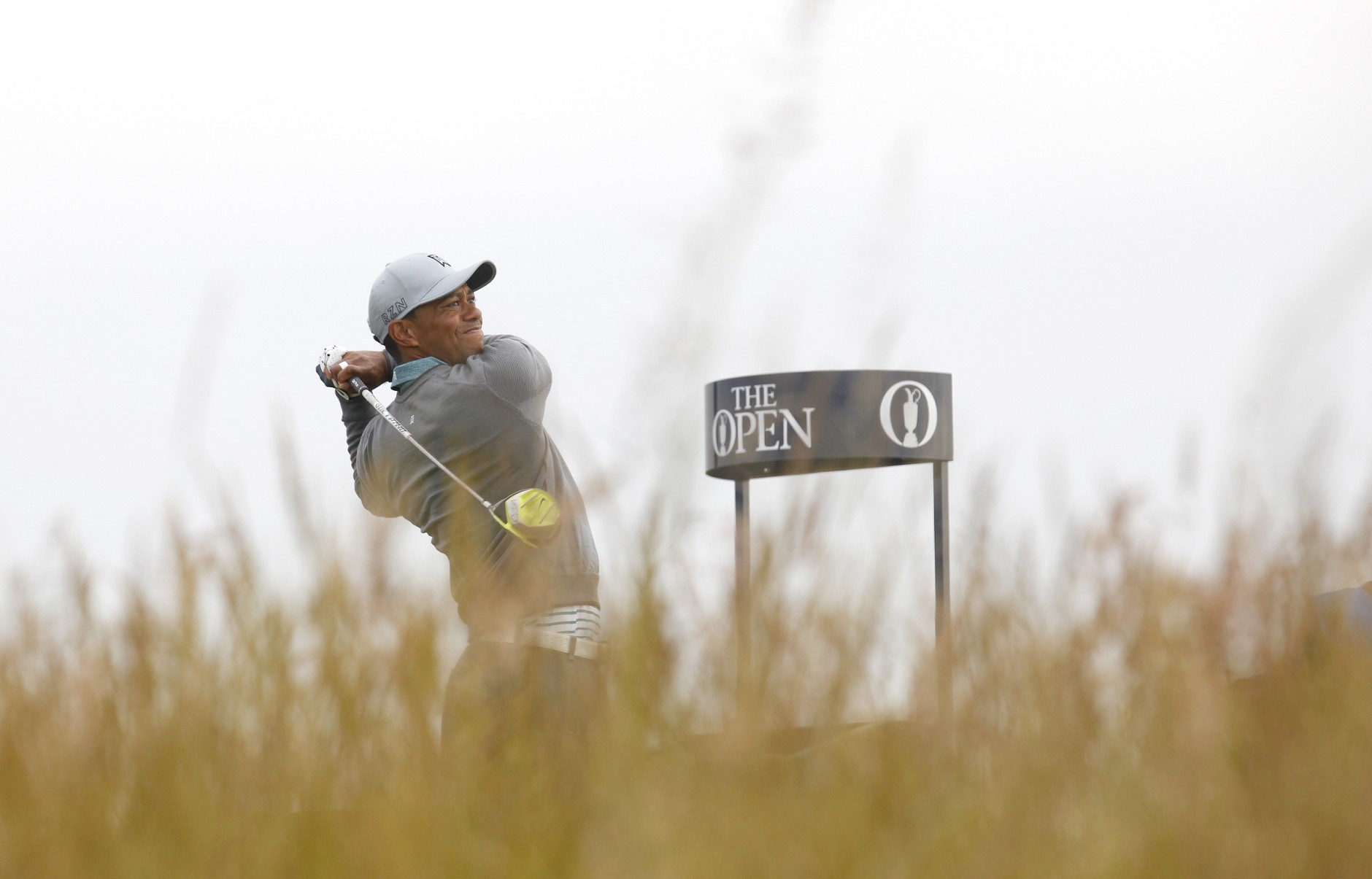 Tiger Woods from the U.S. tees off the 6th hole during a practice round at St. Andrews Golf Club prior to the start of the British Open Golf Championship, in St. Andrews, Scotland, Monday, July 13, 2015. (AP Photo/Peter Morrison)