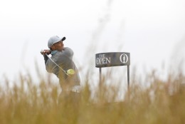 Tiger Woods from the U.S. tees off the 6th hole during a practice round at St. Andrews Golf Club prior to the start of the British Open Golf Championship, in St. Andrews, Scotland, Monday, July 13, 2015. (AP Photo/Peter Morrison)