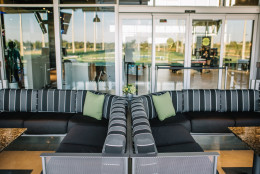 The new three-level, 102-stall complex tower above its predecessor, it will have flat screen TVs at every turn (over 200 in all), a stage area for live entertainment, a 3,000 square foot party space and a game room downstairs with Xbox Kinect stations. (Courtesy Top Golf Loudoun)
