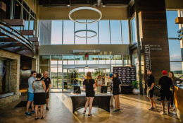 The new three-level, 102-stall complex tower above its predecessor, it will have flat screen TVs at every turn (over 200 in all), a stage area for live entertainment, a 3,000 square foot party space and a game room downstairs with Xbox Kinect stations. (Courtesy Top Golf Loudoun)