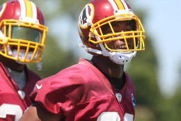 Washington Redskins cornerback Bashaud Breeland, right, smiles during the team's NFL football training camp in Richmond, Va., Friday, July 31, 2015. Breeland was suspended without pay for one game by the NFL on Friday, nearly a full year after he was cited for marijuana possession. (AP Photo/Jason Hirschfeld)