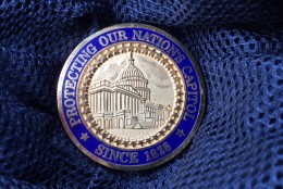 The challenge coin of former Chief of U.S. Capitol Police, Terry Gainer. (WTOP/Kristi King).