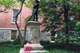 Vandals spray painted a Confederate statues that lies next to the historic Red Brick Courthouse in Rockville. County officials have recently called for the statue to  be moved off county property. (WTOP/Kate Ryan)
