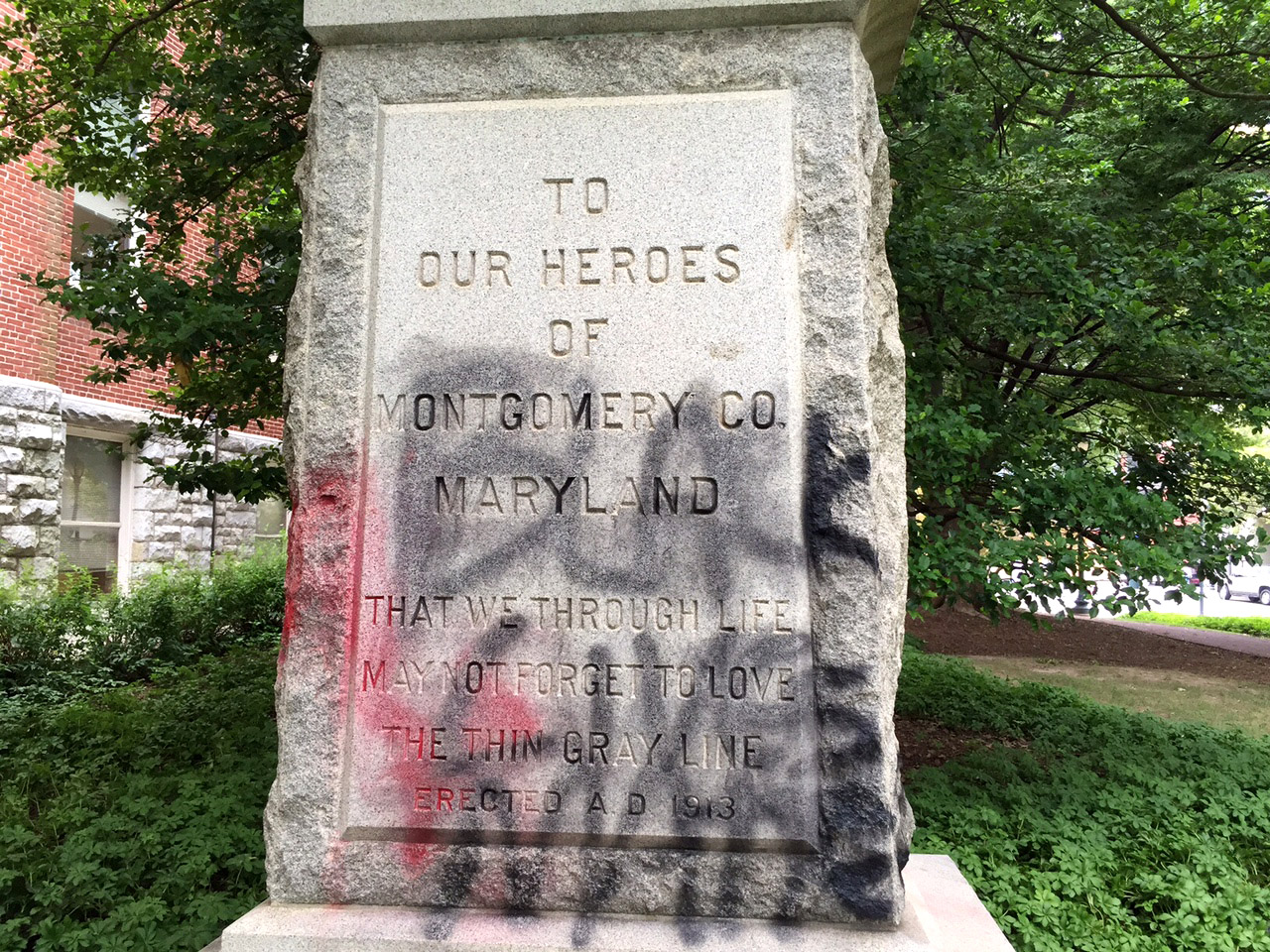 The words "Black Lives Matter" are scrawled across the pedestal of a Confederate statue in Rockville. The vandalism was discovered Monday morning to the sculpture that was already targeted for removal from county property. (WTOP/Kate Ryan)