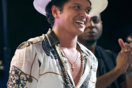 WASHINGTON, DC - JULY 04: Singer Bruno Mars smiles after remarks by U.S. President Barack Obama, accompanied by first lady Michelle Obama, to invited members of the military and White House staff on the South Lawn of the White House on July 4, 2015 in Washington, DC. The guests were treated to a Bruno Mars concert and the traditional fireworks on the National Mall. An earlier Bar-B-Que had been planned but was cancelled due to inclement weather. (Photo by Ron Sachs - Pool/Getty Images)