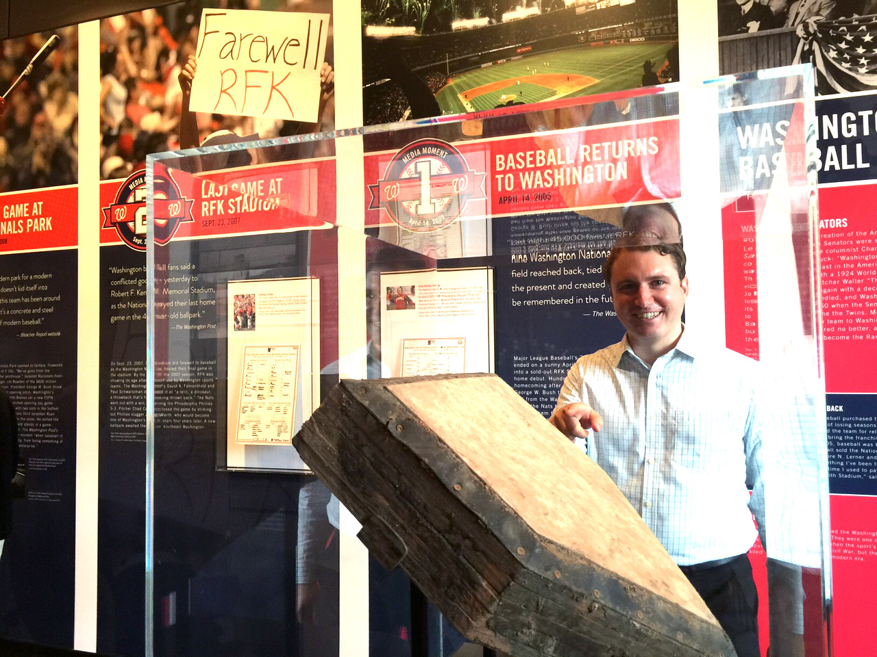 Newseum exhibit writer John Powell takes note of the home plate Jordan Zimmerman threw so many strikes over during his 2014 no-hitter. (WTOP/Kristi King)