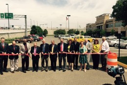 A ribbon cutting for the project in a parking lot next to interchange on Thursday. (WTOP/Max Smith)