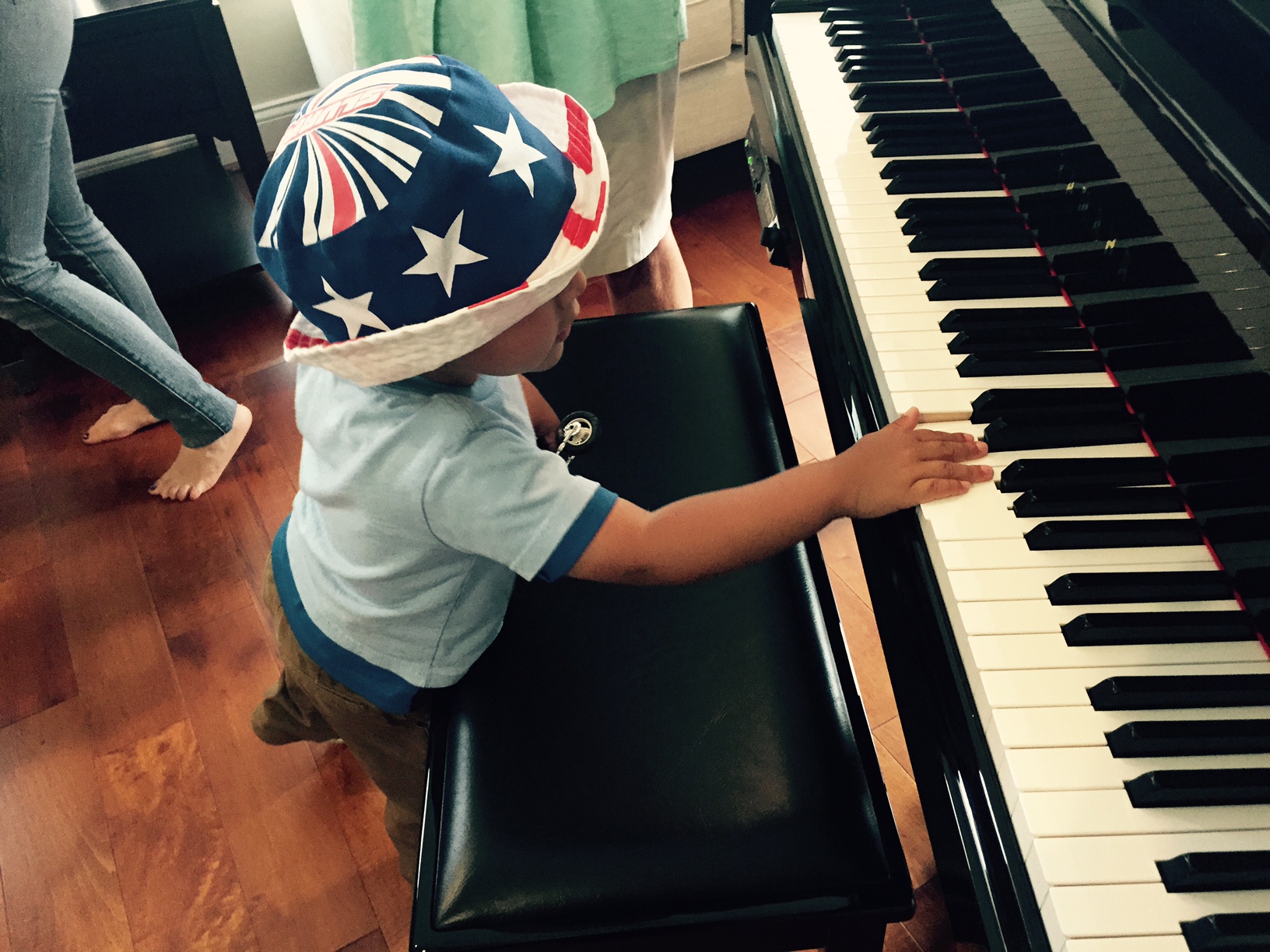 Porta's son plays on the piano in the new house. (WTOP/Max Smith)
