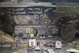 In this Aug. 16, 1987 file photo, bag-covered bodies are strewn across the hillsides flanking Middlebelt Road in Romulus, Mich., after a Northwest Airlines MD-80, bound for Phoenix, crashed shortly after takeoff from Detroit Metropolitan Airport. In the new documentary, “Sole Survivor,” Cecelia Cichan, whose married name is Crocker, at age 4 was the lone survivor of the crash that killed 154 people aboard and two on the ground breaks her silence, discussing how the crash of the Phoenix-bound jetliner has affected her. (AP Photo/Dale Atkins, file)
