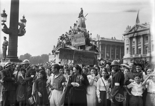 A picture taken onf August 26, 1944 shows Parisians cheering General Charles De Gaulle, President of French Committee of Liberation, as he passes by Place Concorde at the head of the Victory Parade in Paris during the Liberation of the French capital. AFP PHOTO        (Photo credit should read -/AFP/Getty Images)