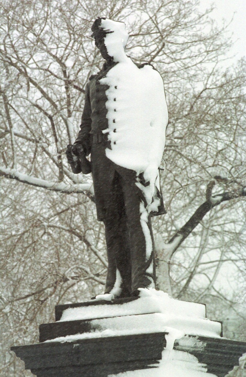 On this date in 1864, during the Civil War, Union Adm. David G. Farragut led his fleet to victory in the Battle of Mobile Bay, Alabama. Here the statue of Farragut is seen in  in Boston, half covered with snow. (AP Photo/John Cetrino)