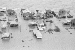 Galveston Bay over flows its banks into Seabrook, Texas early Thursday morning, August 19, 1983. The bay waters were forced ashore due to Hurricane Alicia which came ashore packing winds in excess of 115 miles per hour. (AP Photo)