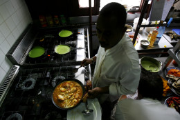 ** FOR STORY SLUGGED CUBA PALADARES **   A Cuban chef cooks paella in La Guarida, Havana's best known paladar, or private restaurant in Havana, Monday, March 10, 2008. (AP Photo/Javier Galeano)