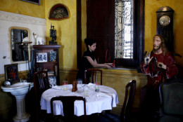 A worker gets ready to attend customers in La Guarida, Havana's best known paladar, or private restaurant, in Havana, Monday, March 10, 2008.  (AP Photo/Javier Galeano)