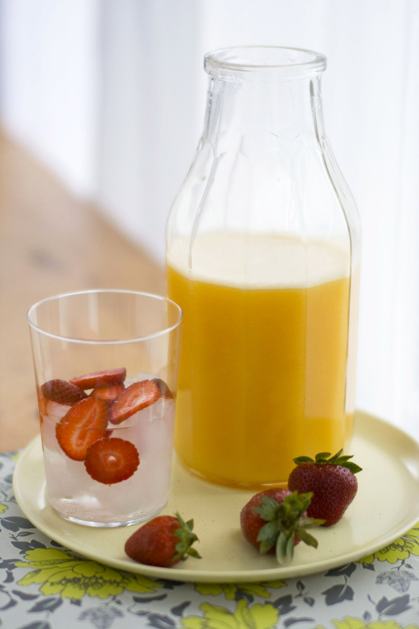 This April 4, 2011 photo shows honey peach sangria in Concord, N.H.  Though often made with red wine, this white wine version of sangria is a delicious accompaniment to summer grilling.  (AP Photo/Matthew Mead)