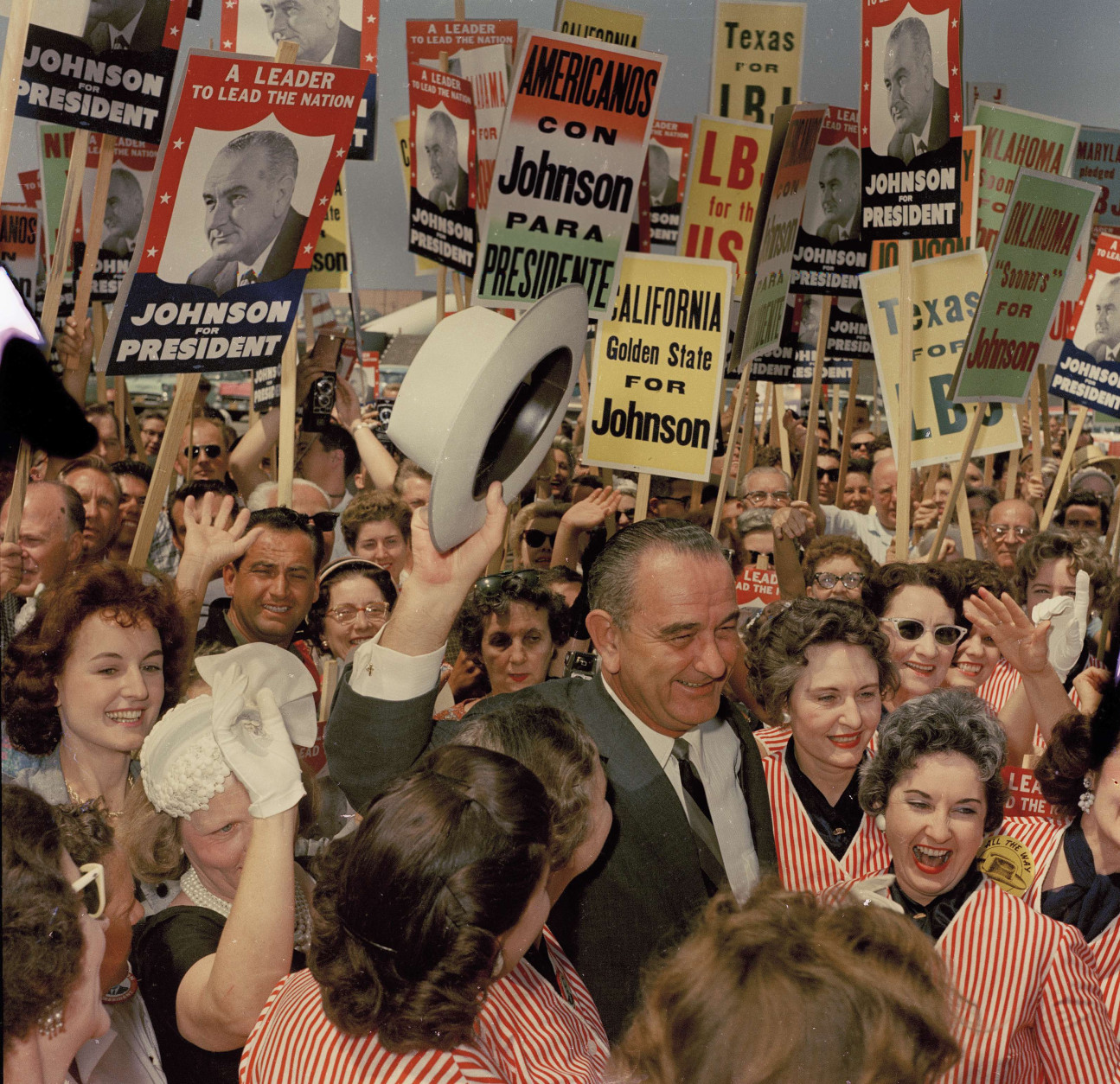 In 1965, President Lyndon B. Johnson signed the Voting Rights Act. Here, Johnson is seen surrounded by supporters as he arrives for the Democratic National Convention in Los Angeles, July 14, 1960.  (AP Photo/Edward Kitch)