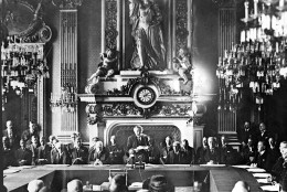 French Foreign Minister Aristide Briand, centre standing, gives his address in the Palais D'Orsay, Paris, Aug. 27, 1928, before the signing of the Pact Of Peace by 15 nations. Seated at table, left to right; Paul Haymans, Belgian Foreign Minister; German Foreign Minister Gustav Stresemann; Briand;  Frank B. Kellogg, American Secretary of State; Lord Ronald Cushendun, Acting Secretary of State for Foreign Affairs for Britain. (AP Photo)