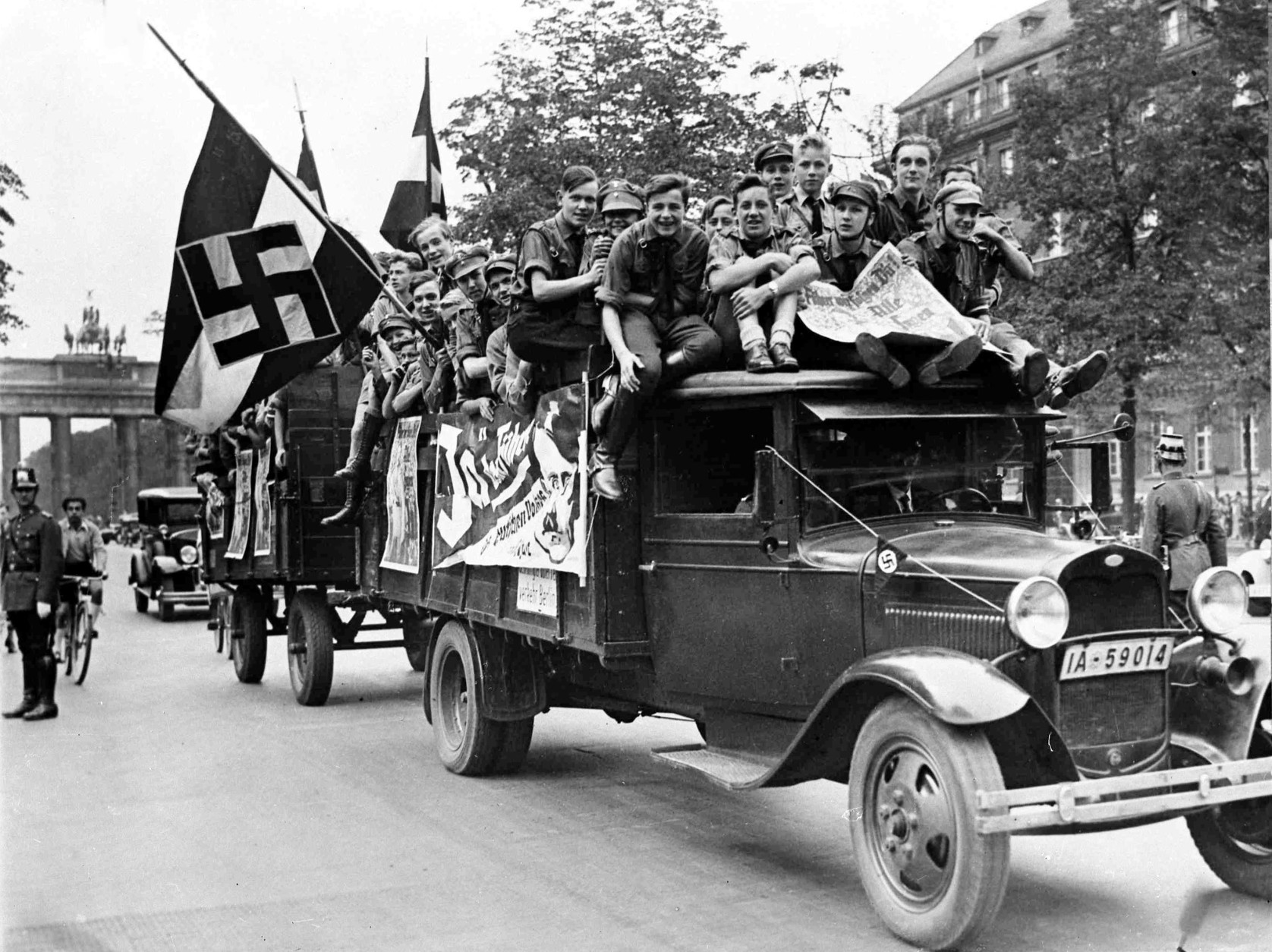 Young Nazis crowd on the back of a truck used for propoganda purposes advising people to vote 'Yes' in the great plebiscite as to whether Adolf Hitler should be elected President, in Berlin, Germany, Aug. 19, 1934. (AP Photo)
