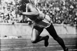 FILE - In this 1936 file photo, Jesse Owens of the United States runs in a 200-meter preliminary heat at the 1936 Summer Olympics in Berlin. Owens won four gold medals at the 1936 Berlin Olympics and showed up Adolph Hitler's idea of Aryan supremacy. The Olympic games are supposed to rise above political interests, but an undertone of politics has been present at every Olympics going back at least to the 1936 games. (AP Photo/File)