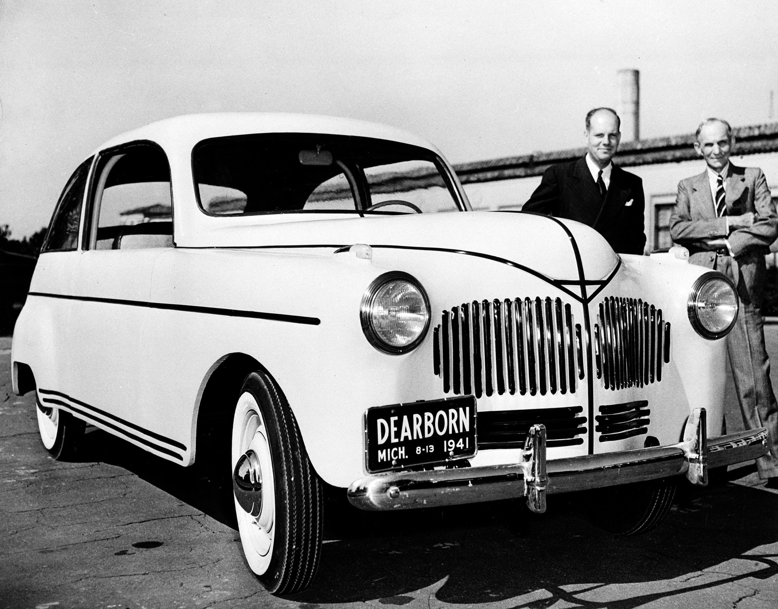 Ford Motor Company founder Henry Ford, right, unveils his new plastic automobile, developed from agricultural products, in Dearborn, Mich., Aug. 13, 1941.  Robert A. Boyer, in charge of Ford Plastics development, is at left.  The experimental, handmade automobile has a plastic body made from soybean and fibers such as field straw, hemp and flax.  The car runs on gasoline and corn-derived ethanol.  (AP Photo)