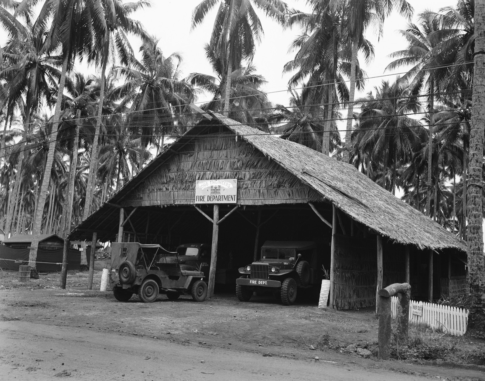 This native style thatched hut houses the Guadalcanal fired department, shown April 26, 1944, which is operated by the Army and consists of the latest fire-fighting equipment. (AP Photo/Frank Filan)