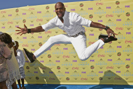 Terry Crews jumps as he arrives at the Teen Choice Awards at the Galen Center on Sunday, Aug. 16, 2015, in Los Angeles. (Photo by Chris Pizzello/Invision/AP)