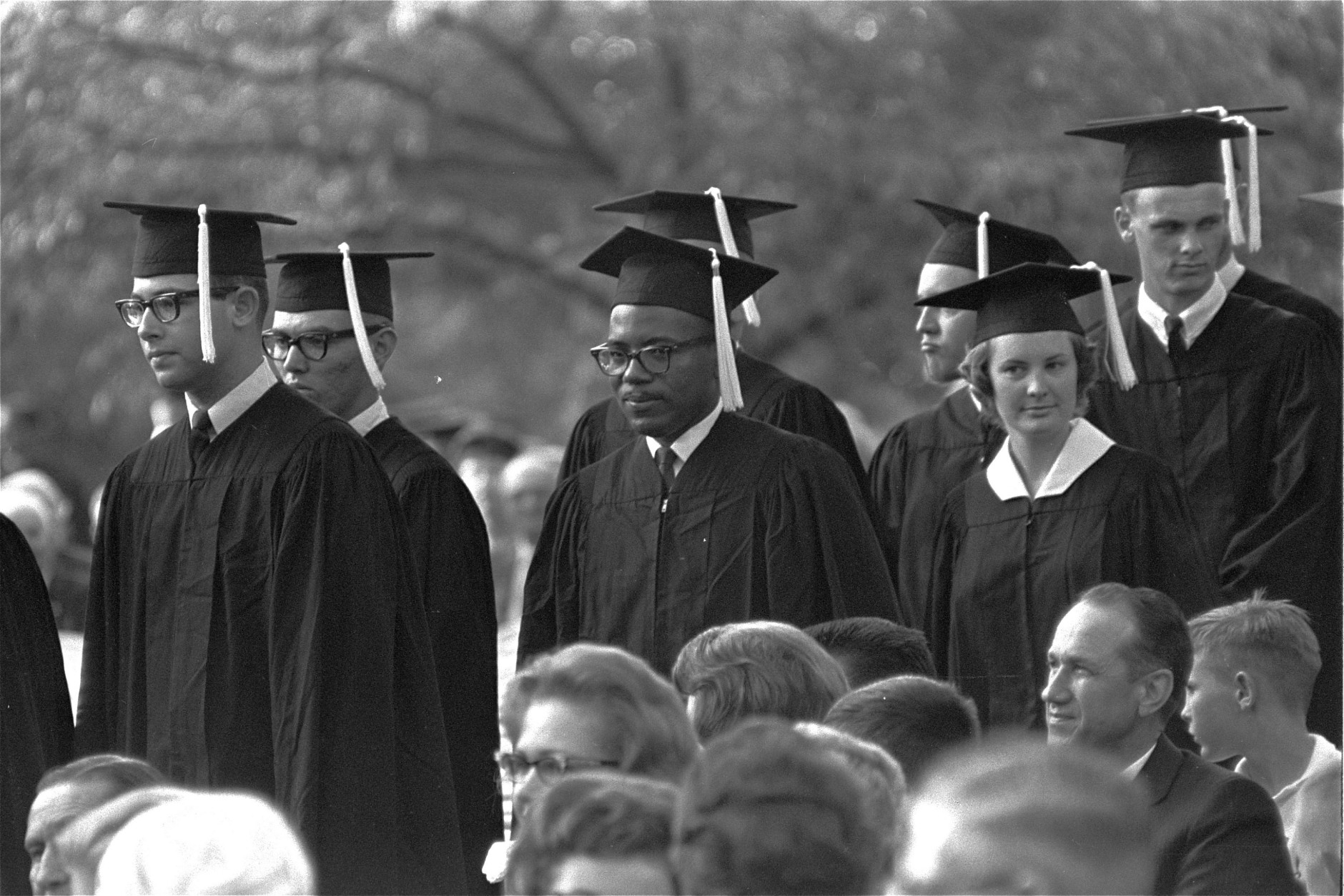 With a tight grin fixed on his face, James H. Meredith stands in line with fellow students awaiting presentation of diplomas at graduation ceremonies, August 19, 1963, at the University of Mississippi at Oxford.  Meredith became the first black man to get a degree from Ole Mississippi.  (AP Photof)