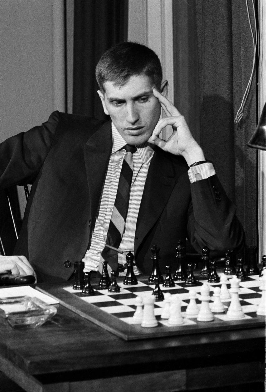 Chess star Bobby Fischer contemplates his next move via wire teletype to Havana, Cuba, Aug. 25, 1965, at the Marshall Chess Club on West 10th Street in New York.  The State Department would not grant Fischer a visa so he could attend the international chess tournament, so arrangements were made for him to compete long distance.  (AP Photo/Dave Pickoff)