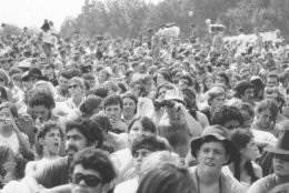 This is a view of part of the crowd at the Woodstock Music and Arts Festival held on a 600-acre pasture in the Catskill Mountains near White Lake in Bethel, N.Y., in Aug. 1969.  The festival, billed as "Thee Days of Peace and Music," started on Friday, Aug. 15.  More than 450,000 persons attended.  (AP Photo)