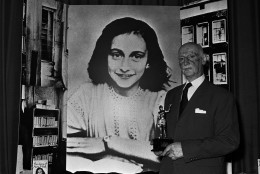 On this date in 1944, 15-year-old diarist Anne Frank was arrested with her sister, parents and four others by the Gestapo after hiding for two years inside a building in Amsterdam. Here, Dr. Otto Frank holds the Golden Pan award, given for the sale of one million copies of the famous paperback, "The Diary of Anne Frank." (AP Photo/Dave Caulkin)